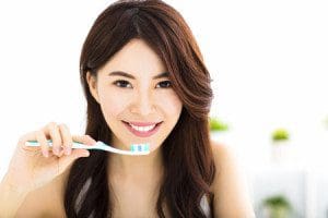 44053415 - Young Woman Brushing Teeth In The Morning