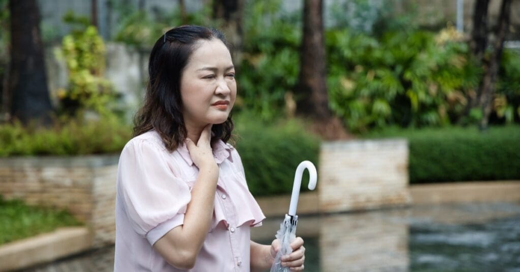 Asian Woman Holding Throat, Concept Of The Link Between Allergies And Your Teeth