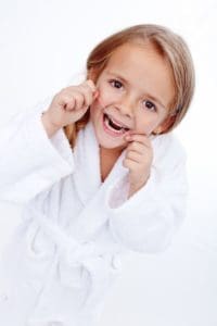 child flossing, concept of making flossing a fun family activity