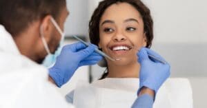 Dentist working on girls teeth