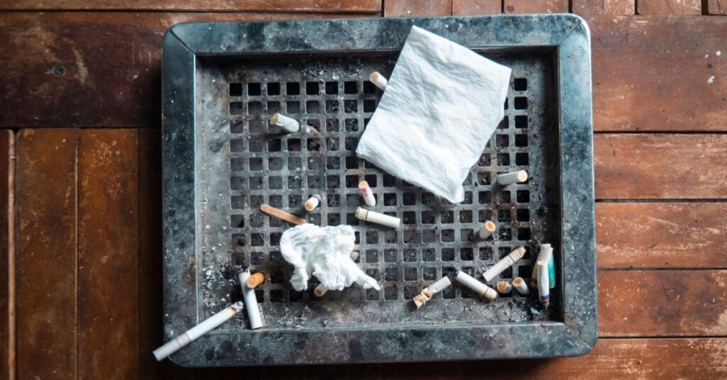 Cigarettes In Ash Tray, Concept Of Achieve Radiant Pearly Whites: 7 Tips For A Beautiful Smile