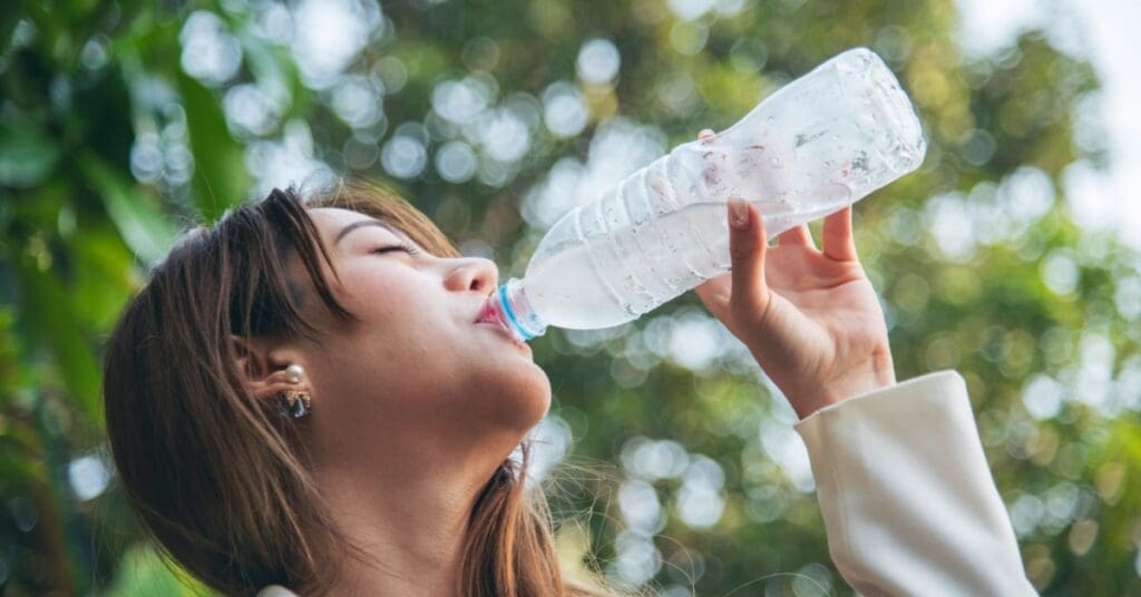 Which Foods Make Your Teeth Whiter? Which Foods Make Your Teeth Whiter Woman Drinking Water Representing Which Foods Make Your Teeth Whiter